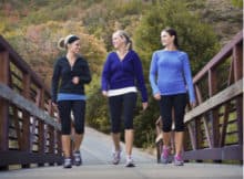 three women talking a walk together