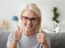 excited woman giving two thumbs up