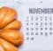 a calendar showing November with a pumpkin close by for the Slots Play Casinos promos
