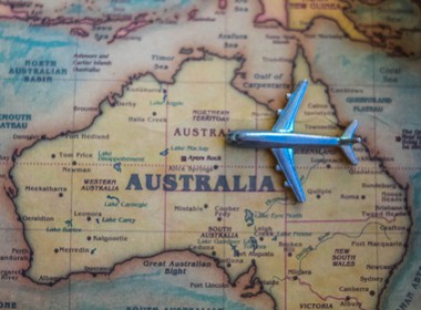 model airplane sitting on a vintage map of Australia