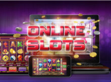the words online slots in red with two smartphone screens of slots. everything is against a purple background.