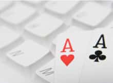 two aces on a computer keyboard indicating online casino gaming