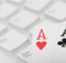 two aces on a computer keyboard indicating online casino gaming