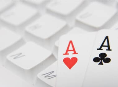 two aces on a computer keyboard indicating online casino gaming