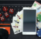 a smartphone with many of the accoutrements of online casino gaming such as dice, casino chips, and cards.
