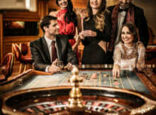 a group of attractive and well-dressed young people loudly playing roulette at a land-based casino