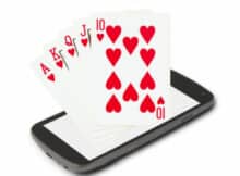 a Royal Flush in hearts emerging from a smartphone showing the value of online video poker