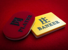 a banker card in yellow and a player card in red as the two participants in baccarat are called