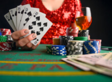 woman showing a straight flush while sitting at the poker table