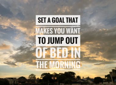 early a.m. cloudy sky with graphic saying: Set a Goal that Makes You Want to Jump out of Bed in the Morning