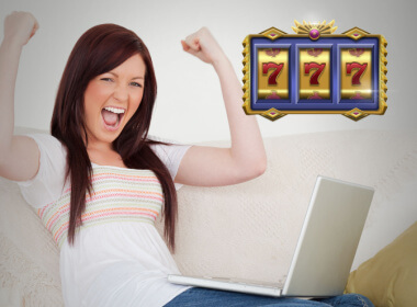 young woman celebrating a win at online slots with raised hands and big smile. The 777 in the corner shows that she won at slots