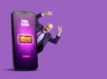 smartphone with "jackpot" on its face and a smiling older bald-headed man coming out of the side of the phone