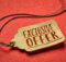 light beige tag like a price tag with the words exclusive offer in cordovan against an orange background