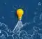 a yellow light bulb suspended in the air above blue clouds representing innovation and creativity